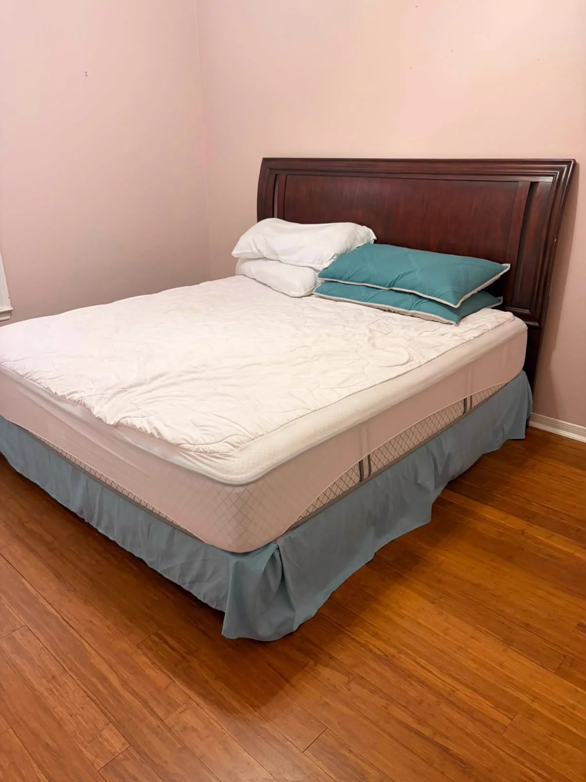 Bed and mattress shown as residential item-removal context